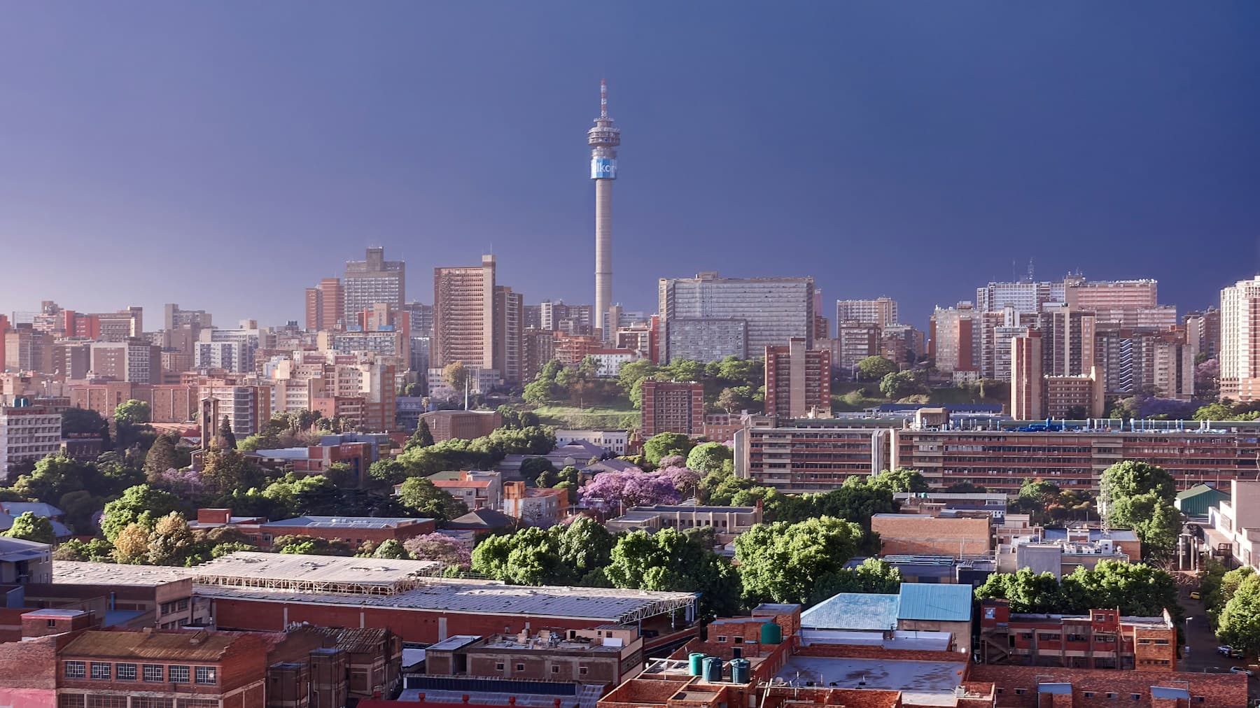 Johannesburg towers beneath a dramatic cloudy sky